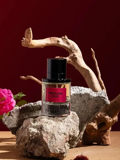An earthy and artistic still life for a fragrance. We used natural elements like stone, driftwood, and a fresh rose to capture the rich, natural essence of this Persian Oud perfume.