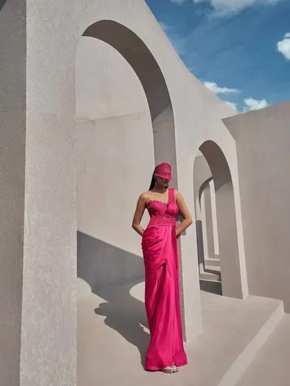 Drenched in hot pink and draped with boldness, this corset sari is not just an outfit, it’s a statement of unapologetic confidence.