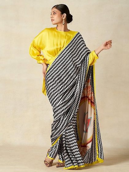 Another look from the Gulabo by Abu Sandeep shoot. The makeup remains consistent with a focus on elegant, defined features that work beautifully with the modern, graphic saree.