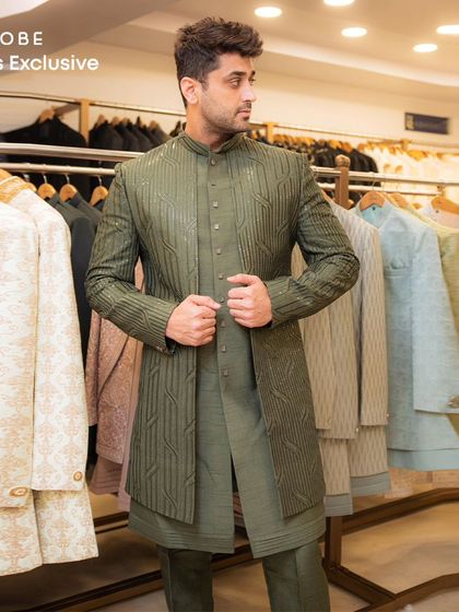 This olive green layered Indo-western outfit offers a structured and sophisticated look. The textured fabric and clean lines make it a standout piece.