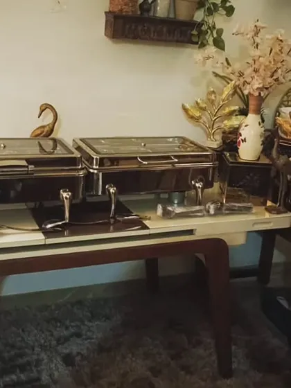 A cozy and intimate setup for a gathering of 20 guests in South City 2, Gurugram. The arrangement includes a main buffet and a separate beverage station for convenience.