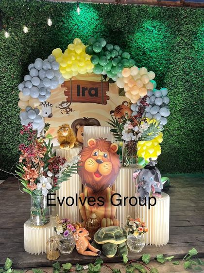 Our jungle-themed birthday decor is all about creating an immersive experience. This setup features a lush green backdrop, a variety of animal props, and a colorful balloon arch to bring the wild adventure to life.