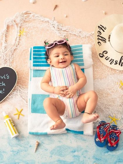 Soaking up the sun in our indoor beach setup. This "Hello Sunshine" theme is perfect for bringing beachy vibes to a milestone shoot any time of year.