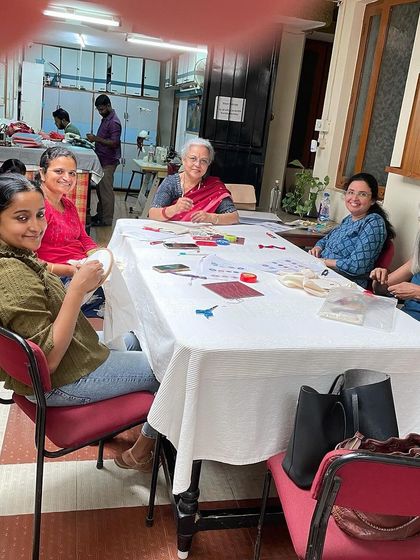 A happy group of students at a mirror work workshop. The smiles on their faces show the sense of accomplishment that comes from learning a new skill.