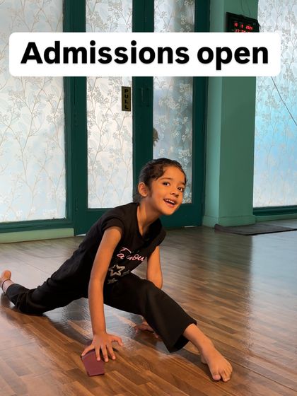 With a happy and confident expression, this student holds her split perfectly. This image captures the positive results of our contemporary beginners' program.