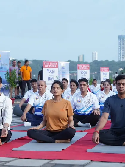 A closer view of the participants at "Yoga by the Bay," including public figures and citizens practicing side-by-side. This event truly embodies the unifying power of yoga.
