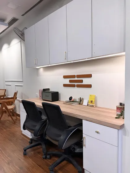The co-working desk area in my studio, perfect for client meetings, editing, or collaborating on creative projects.
