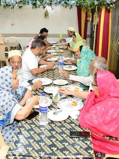 A family enjoying their meal together. We love these candid moments.
