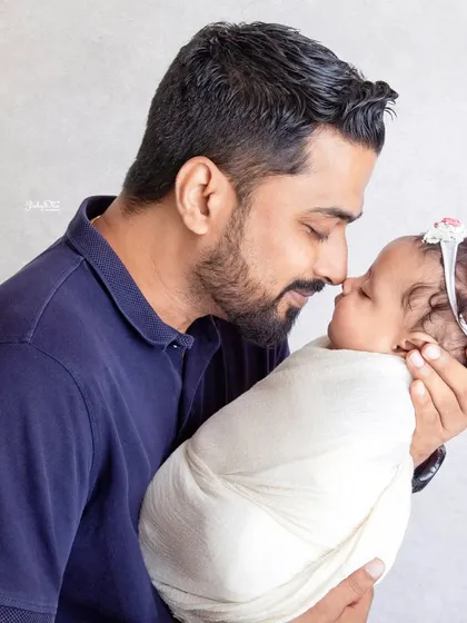 A sweet nose-to-nose moment between father and baby. It's a simple gesture that shows such a deep and loving connection.
