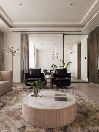 In this living room, we blended soothing shades of brown and cream to create a tranquil haven. The wide-angled view highlights the modern wall art and the elegant decor, telling a story of effortless style and comfort.
