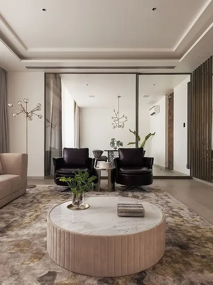 In this living room, we blended soothing shades of brown and cream to create a tranquil haven. The wide-angled view highlights the modern wall art and the elegant decor, telling a story of effortless style and comfort.