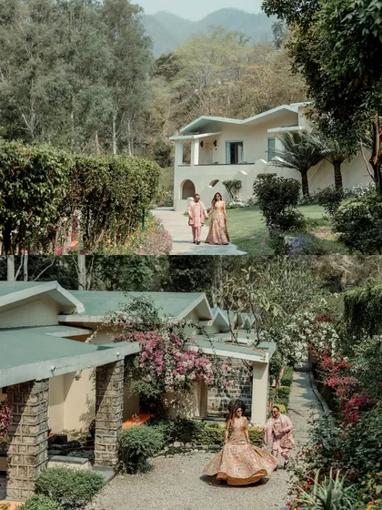 A wide shot of the couple walking through the beautiful resort grounds, showcasing the destination wedding vibe.