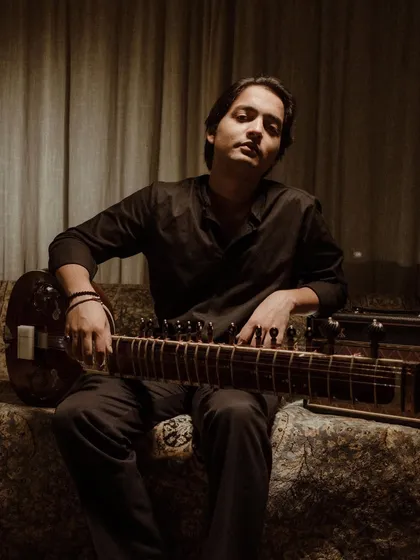 A moment of rest with my sitar. It is my constant companion on this musical journey.
