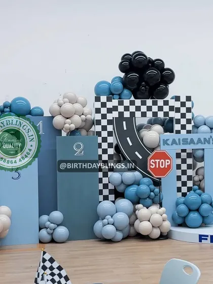 A modern, block-style race car theme with a cool blue and black color palette. The stop sign and checkered details add to the fun.