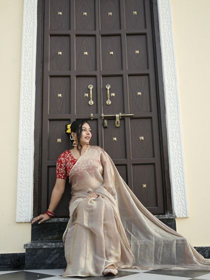 The way the jhumkas sit against the backdrop of the organza saree and embroidered blouse is just perfect. It’s a classic, timeless Indian look.
