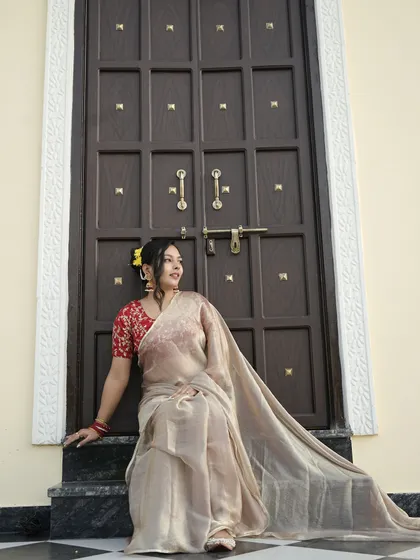 The way the jhumkas sit against the backdrop of the organza saree and embroidered blouse is just perfect. It’s a classic, timeless Indian look.