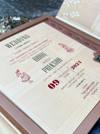A detailed view of the main wedding insert. The modern layout is complemented by traditional illustrations and rich red highlights, perfectly blending contemporary design with heritage aesthetics for a truly unique wedding card.