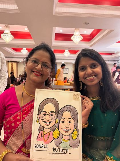 A mother and daughter duo with their lovely caricature, a shared memory from a family celebration.