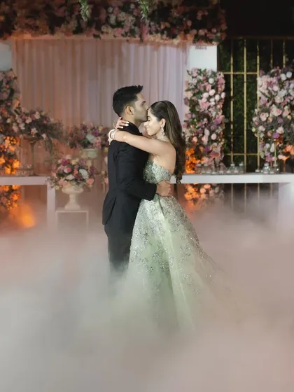 A perfect moment from a couple's first dance, surrounded by a dreamy fog effect. We help create these picture-perfect memories.