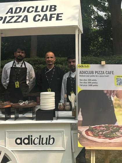My team posing at the custom "adiclub Pizza Cafe" we set up for Adidas. We take pride in delivering a professional and memorable catering service for our corporate partners.