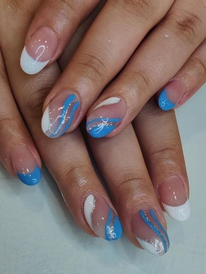 A cool-toned abstract design with blue and white swirls, accented with a touch of silver glitter. This look is reminiscent of ocean waves.