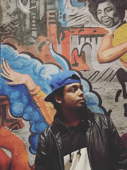 The grind don't stop. Posing against some street art that represents the hip-hop culture I love.