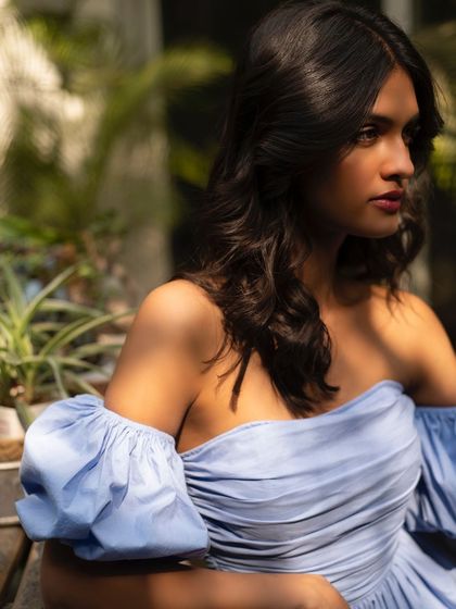 A sun-drenched summer fashion portrait for It Girl. The light filtering through the leaves creates a beautiful, natural pattern.