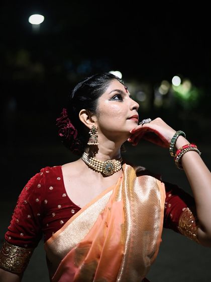 A moment of contemplation in a night-time photoshoot. This artistic portrait focuses on the emotive power of the eyes and subtle gestures in Kathak.