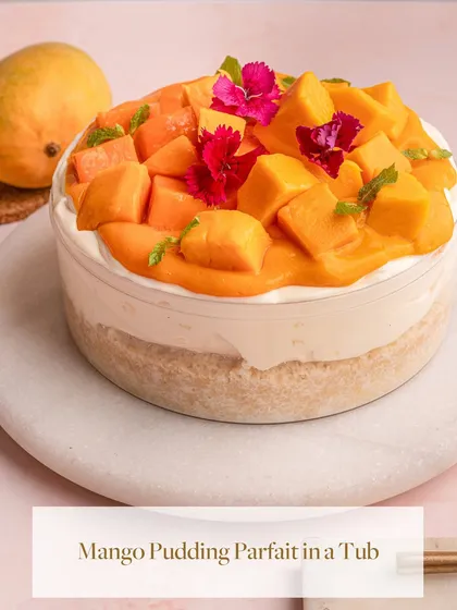My Mango Pudding Parfait in a Tub, handcrafted with the finest seasonal Alphonso mangoes. Layers of milk-infused vanilla sponge, vanilla pudding, and fresh mango create a taste of seasonal bliss.