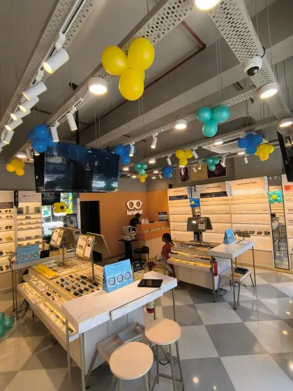 We design interior decorations that enhance the shopping experience without causing clutter. For the Lenskart store, we installed simple balloon bunches on the ceiling, matching the brand colors and adding a celebratory feel to the space.
