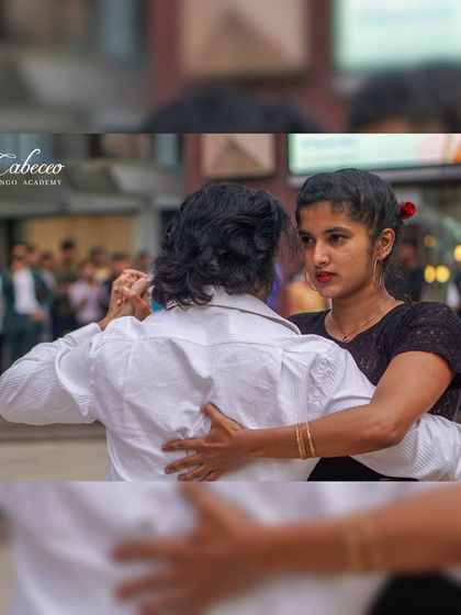 The intensity and focus of the Tango embrace, seen here during our public dance event. It's a dance that brings people together.