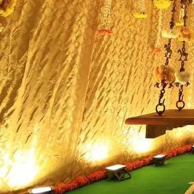 Another angle of the ceremonial swing and backdrop. This setup is ideal for intimate at-home celebrations, transforming a part of the home into a beautiful, sacred space.