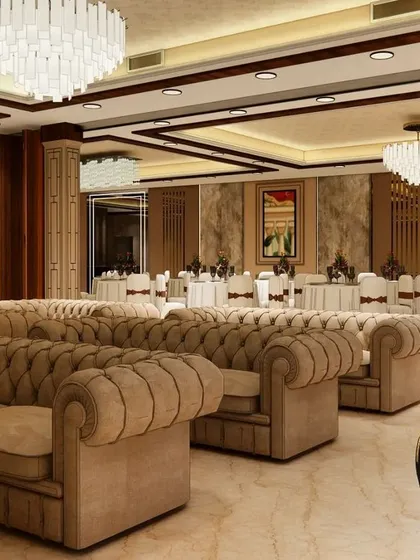 This render shows the interior lounge area for our upcoming banquet hall in Gorakhpur. We've used plush, tufted sofas and crystal chandeliers to create a luxurious and comfortable seating space for guests.