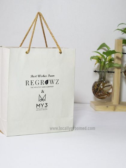 A closer look at the custom paper bag we created for Regrowz and My3. The minimalist design and sturdy rope handles provide a touch of luxury.