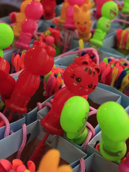 A close-up of the bubble wands and other fun toys that filled the piñata bags for the kids.