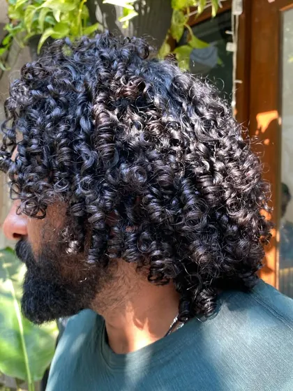 This is what I call hair goals for men. These luscious, defined curls are the result of a great haircut and a simple styling routine.