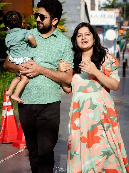 A candid walking shot of the family on Church Street, capturing a natural and happy moment.