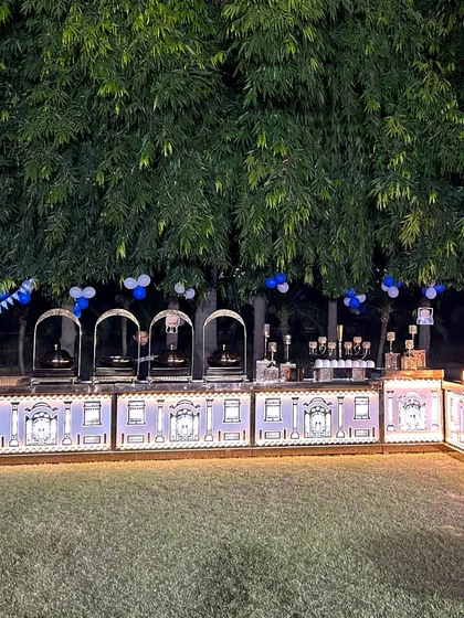 A full view of the L-shaped illuminated buffet counter. This setup allows for a long, continuous display of food and decor, making it a grand centerpiece for any large gathering.
