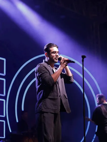 We also manage top-tier entertainment. Here, the lead singer of Sanam Band performs on the custom-designed stage, perfectly integrated with the neon theme.