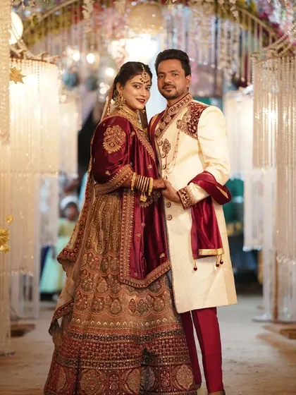 The couple looks confidently at the camera, a perfect formal portrait from their wedding reception.