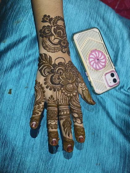 A beautiful lotus mehndi design for a bride. The lotus symbolizes purity and beauty, making it a perfect choice for a wedding.