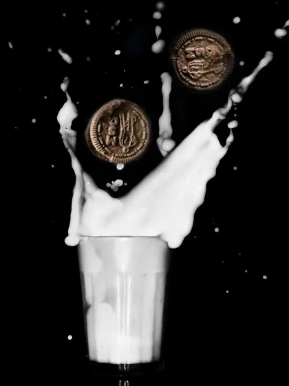 Fun and energetic, this action shot captures Oreo cookies splashing into a glass of milk. This type of dynamic food photography is perfect for creating memorable and engaging content for social media campaigns.