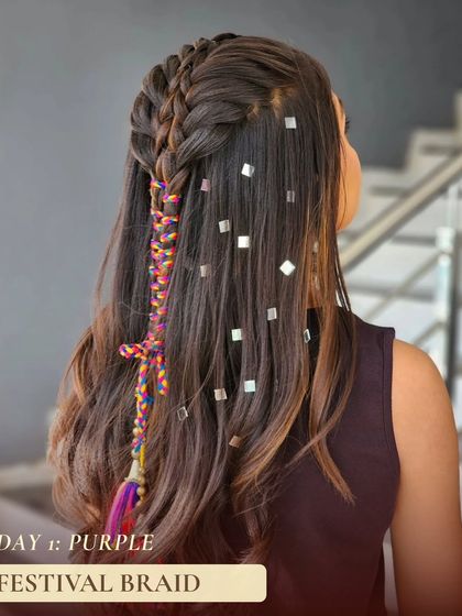 For day one of Navratri, corresponding with the color purple, this festival braid is perfect. It incorporates colorful threads and metallic accents for a fun and vibrant look.