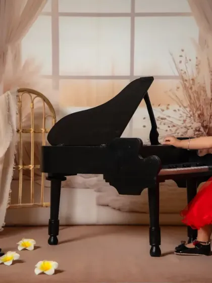 Little fingers, big melodies. This shot captures the joy of making music.