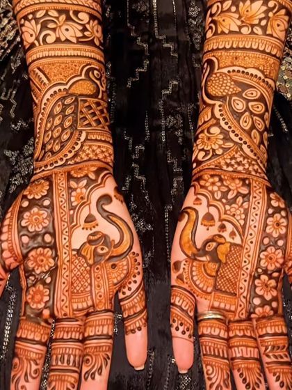 This Rakhi design is filled with traditional Indian motifs like elephants and peacocks. It’s a rich and detailed pattern that looks stunning.