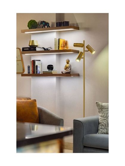 These sleek floating shelves in our Rue 32 project utilize the depth of a structural column to connect the dining and living areas. This innovative design is a great space-saving solution for open-plan homes.