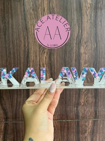 A custom name stand for 'Ekalavya' with blue and purple accents. These stands are great for personalizing a workspace or study table.