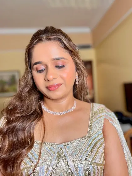A close-up of the dazzling eye makeup. I used a beautiful blend of champagne and gold glitter to create a look that is both festive and sophisticated.