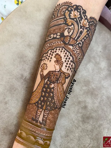 A close-up of the groom figure, showcasing the detailed work on his sherwani and turban. This is a perfect example of how I bring portraits to life in henna.