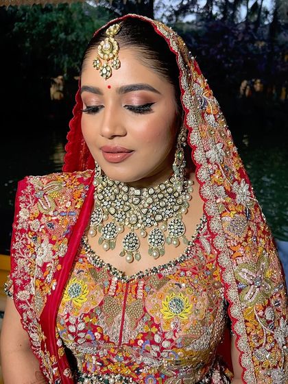 A close-up of the bride's soft glam makeup, with a focus on the rosy eyeshadow and flawless skin.